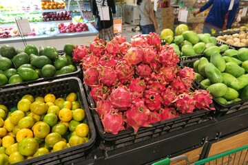 Tropical fruits and vegetables at the market. Healthy produce in an Asian supermarket. 