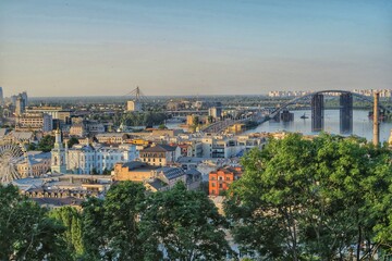 Kyiv skyline, panorama view of the city and river, bridge. Green trees and old cathedrals. Kyiv/Kiev Ukraine. 
