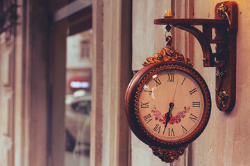 Retro style wall clock. Vintage colors.