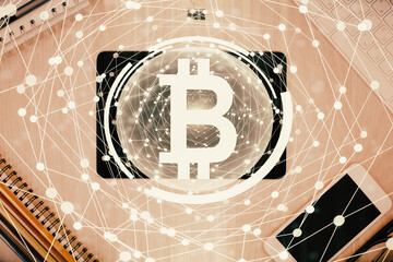 Double exposure of blockchain theme hologram over table with phone. Top view. Crypto technology...