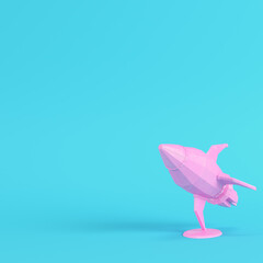 Pink rocket with stand on bright blue background in pastel colors. Minimalism concept