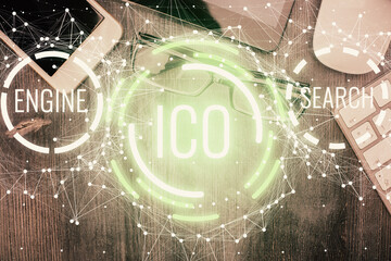 Double exposure of blockchain theme hologram over table with phone. Top view. Crypto technology...