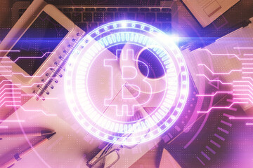 Double exposure of blockchain theme hologram over table with phone. Top view. Crypto technology...