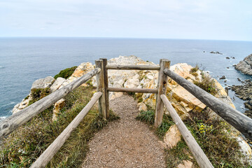 boardwalk to the beach, photo as a background , in playa del silencio , silent beach, principado de...
