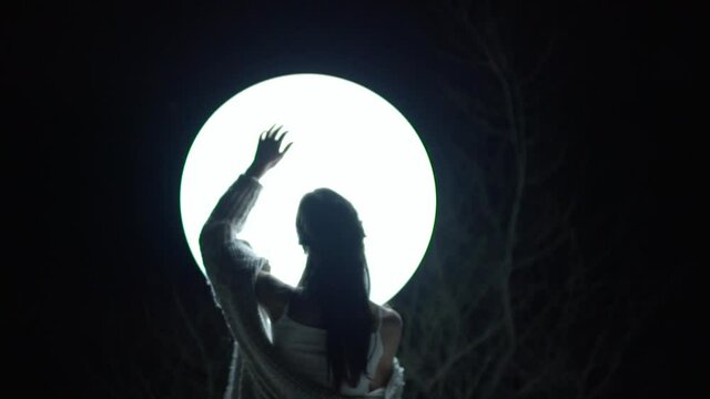 Woman in the Dark Forest With Illuminated White Balloon 5