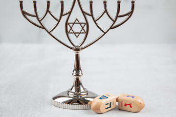 Jewish menorah at Hanukkah on a white marble background