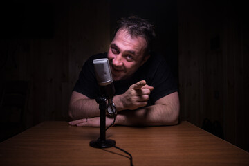 Serious reporter in television studio looking at the camera