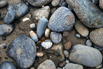 Big and small stones on the sea coast.