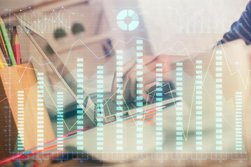 Double exposure of woman hands typing on computer and forex chart hologram drawing. Stock market invest concept.