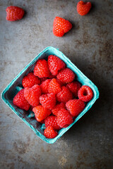 Organic red raspberries in a box