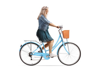 Young woman riding a blue city bicycle