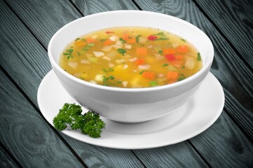 Bowl of delicious vegetable soup on a table