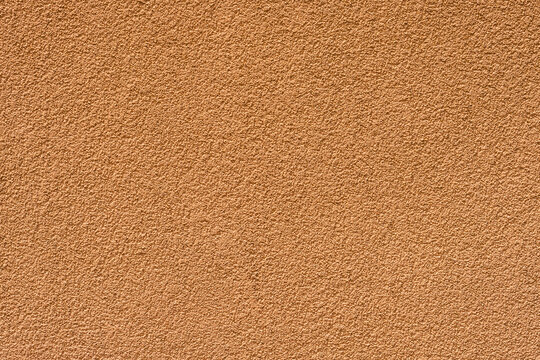 Decorative Silicone Plaster Texture Background. Orange Exterior Wall Finish 