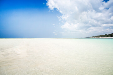 White sand with blue sky travel destination background 
