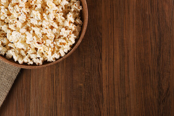 Popcorn on a wooden background. Close-up, top view