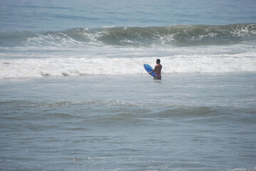 surfer on the beach in quarantine