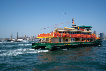 Sydney, NSW / Australia - 26th January 2019: Australia day ferry race 2019, orange ferry racing up...