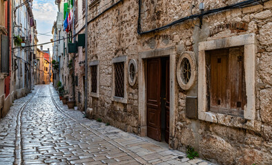 Fototapeta na wymiar A narrow street in the old town of Rovinj in Croatia