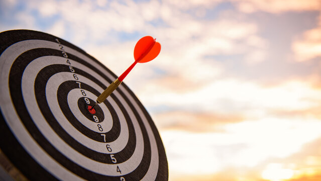 business marketing as concept. Red dart arrow hitting in the target center of dartboard Target hit in the center.