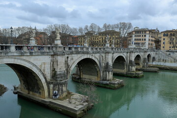 Fototapeta na wymiar A view of famous river bridges in the city of Rome. Italy