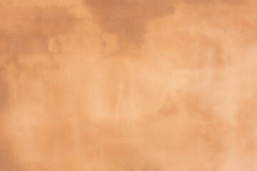 rusty brown orange textured outdoor wall with stains and a rough exterior wall