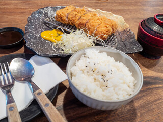 Japanese style fried pork set meal set on wooden table.