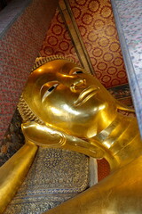 Wat Pho Buddhist Temple. Bangkok, Thailand. Every detail in the temple area, decorated with extraordinary decorations, is appreciated by all visitors.