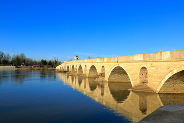 Fototapeta premium Meric bridge, Turkey.In Edirne on the border with Greece, the river Meric and its bridge, and the Selimiye Mosque in the background.
