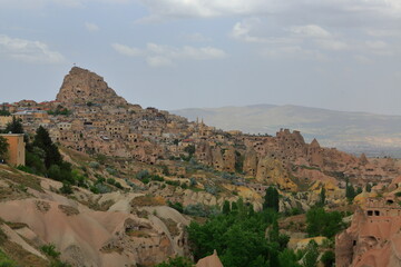 Fototapeta na wymiar Cappadocia region, Uchisar settlement and fortress.It is formed by volcanic tuffs, where nature and history are integrated in the world. Turkey