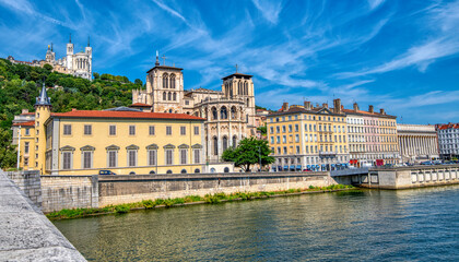 Fototapeta na wymiar A pic taken from a bridge in Lyon France of the buildings along the river Rhone