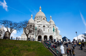 Tourists visiting the Sacre Coeur Basilica at the Montmartre hill in Paris France