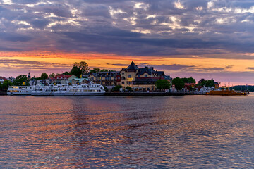 Vaxholm with boats at the quay and hotel a nice summer evening