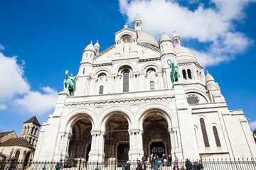 Fototapeta na wymiar Tourists visiting the Sacre Coeur Basilica at the Montmartre hill in Paris France