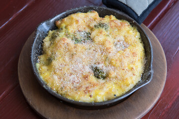 Homemade Baked Mac and Cheese on wooden table