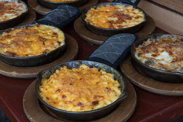 Homemade Baked Mac and Cheese on wooden table