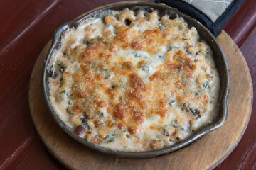 Homemade Baked Mac and Cheese on wooden table