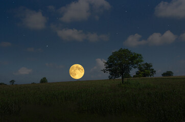 Romantic full moon over the hill in countryside