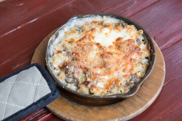 Homemade Baked Mac and Cheese on wooden table