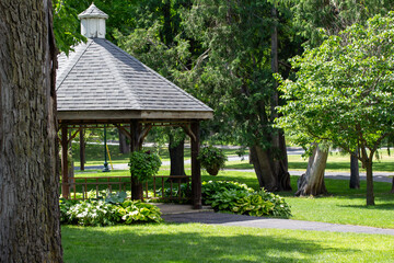 Landscaped gazebo pavilion in a city park garden area