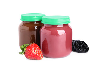 Jars with baby food, strawberry and dried plum on white background