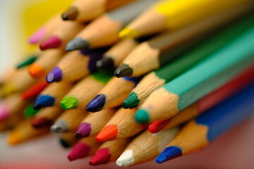 closeup stack of colored pencils. This pencil drawing is used as stationery and painting tools. macro photography. colorful colored pencils.