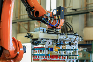 View of gripper unit on industrial robot in automation line