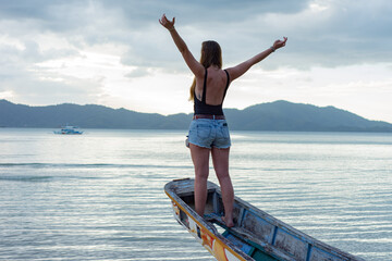 Fototapeta na wymiar Girl on the beach, Port Barton, Philippines