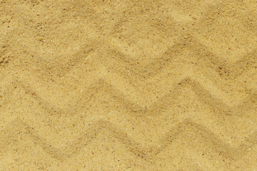 Sand texture from tire. Smooth sandy background.