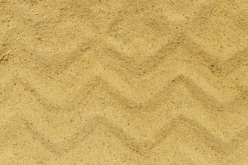 Sand texture from tire. Smooth sandy background.