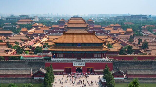 Beijing, China, zoom out timelapse view of people at the gates of the ancient Forbidden City palace complex. Translation of Chinese characters: The Palace Museum.