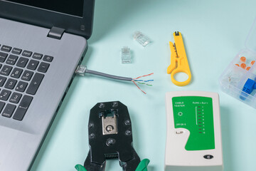 The process of connecting an rj 45 cable to a laptop.