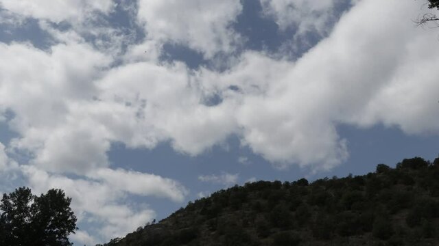 Dramatic clouds time lapse. Clouds on a cloudy day moving fast.