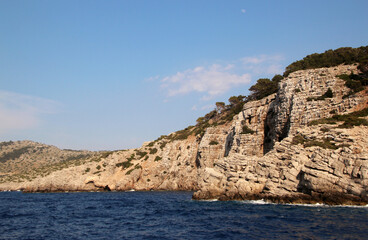 Fototapeta na wymiar Symi island, rocky seashore, the Aegean Sea, Greece