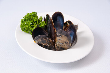 A plate of clams on a white background
